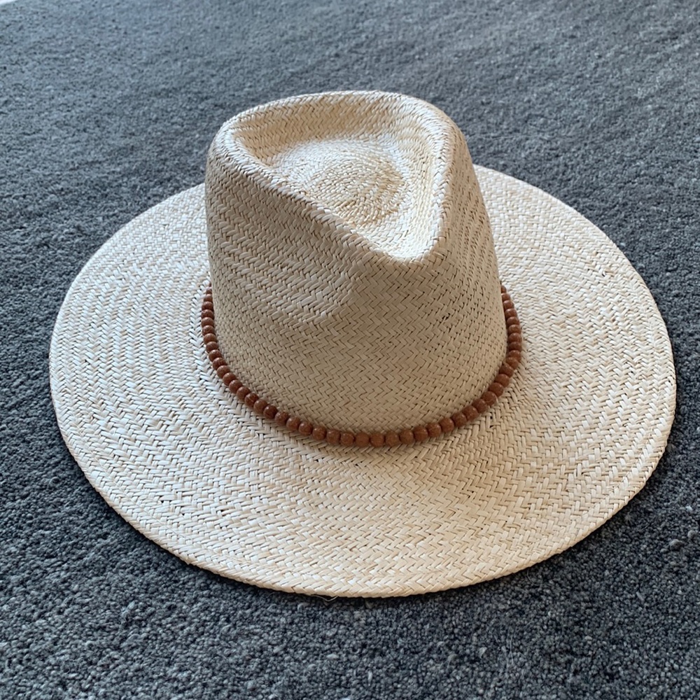 WYETH wide brim- like new- straw hat with bead detail around crown. Adjustable.m
